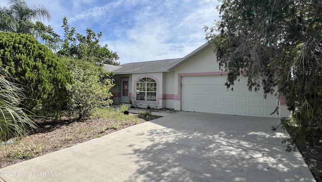 1469 California Dr, Melbourne, FL 32940 - view of front of property featuring concrete driveway, a garage, stucco siding, and a shingled roof