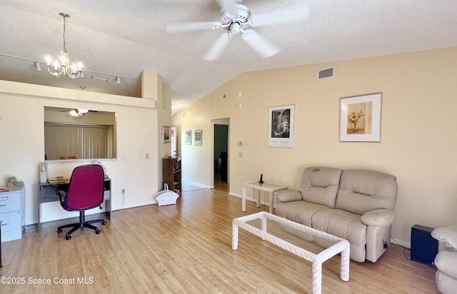 1469 California Dr, Melbourne, FL 32940 - living area featuring a ceiling fan, an office area, wood finished floors, vaulted ceiling, and a chandelier