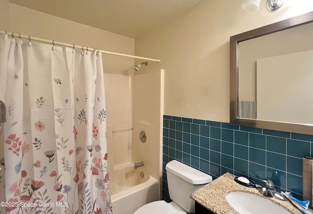 1469 California Dr, Melbourne, FL 32940 - full bath with shower / bath combo with shower curtain, vanity, a wainscoted wall, and tile walls