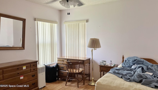 1469 California Dr, Melbourne, FL 32940 - bedroom with light wood-style floors and a textured ceiling