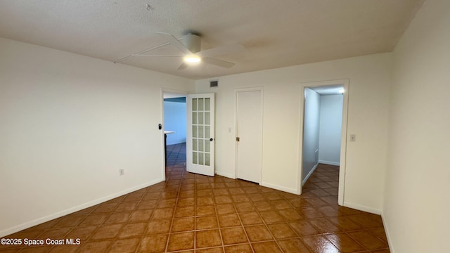 650 N Atlantic Ave Unit 406, Cocoa Beach, FL 32931 - unfurnished bedroom with tile patterned flooring and a ceiling fan
