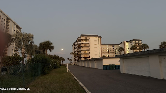 650 N Atlantic Ave Unit 406, Cocoa Beach, FL 32931 - view of street featuring community garages