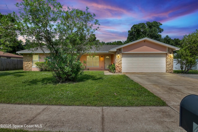4480 Westview Ln, Titusville, FL 32780 - ranch-style house with stone siding, driveway, an attached garage, and stucco siding