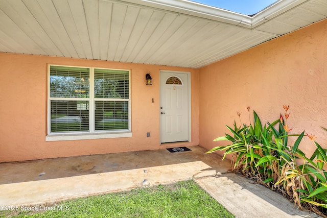 4480 Westview Ln, Titusville, FL 32780 - view of exterior entry featuring stucco siding