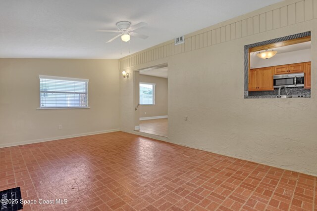 4480 Westview Ln, Titusville, FL 32780 - unfurnished room with brick patterned flooring and ceiling fan