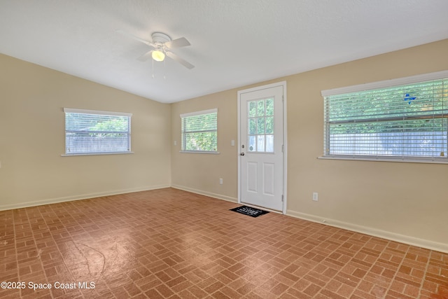 4480 Westview Ln, Titusville, FL 32780 - entrance foyer featuring brick patterned flooring, a ceiling fan, and lofted ceiling
