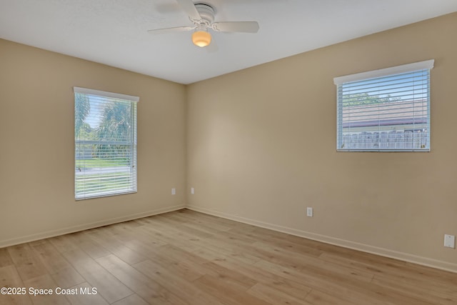 4480 Westview Ln, Titusville, FL 32780 - empty room with light wood-style flooring and ceiling fan