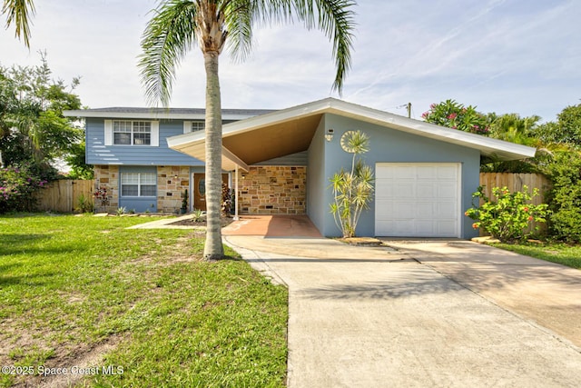 949 Brunswick Ln, Rockledge, FL 32955 - view of front of home featuring stone siding and driveway