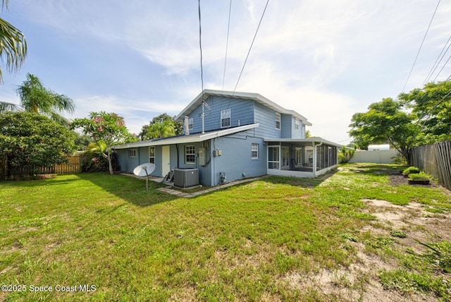 949 Brunswick Ln, Rockledge, FL 32955 - back of house featuring a sunroom and a fenced backyard