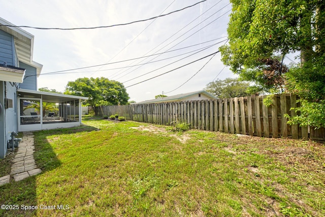 949 Brunswick Ln, Rockledge, FL 32955 - fenced backyard with a sunroom