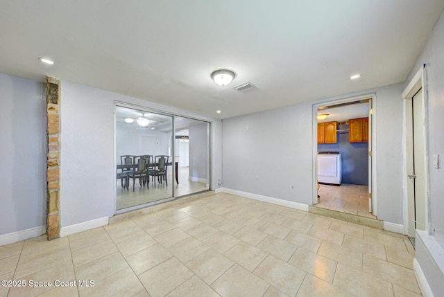 949 Brunswick Ln, Rockledge, FL 32955 - spare room with washer / clothes dryer, light tile patterned floors, and recessed lighting