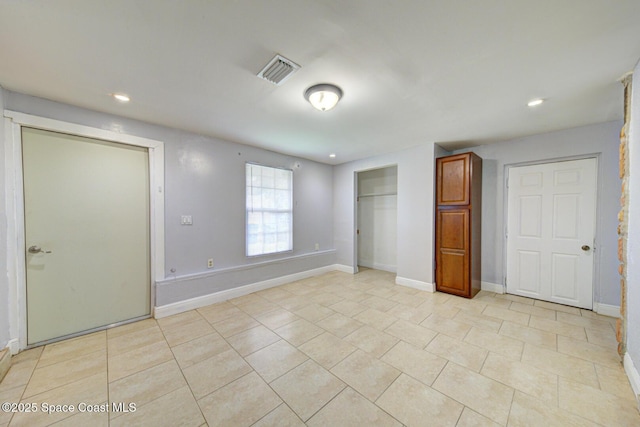 949 Brunswick Ln, Rockledge, FL 32955 - unfurnished bedroom featuring recessed lighting, light tile patterned floors, and a closet
