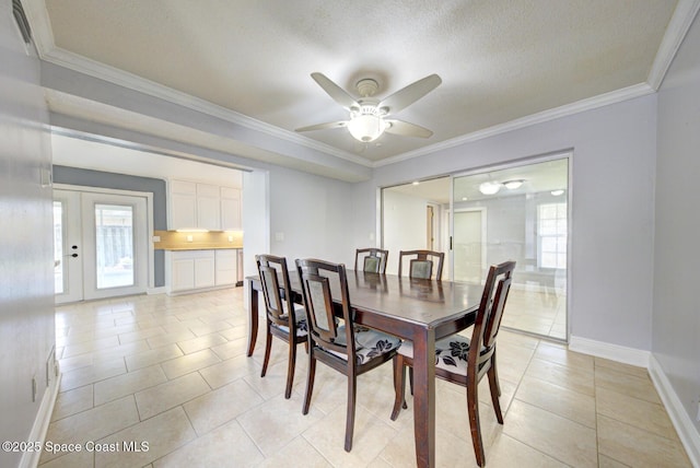 949 Brunswick Ln, Rockledge, FL 32955 - dining room with light tile patterned floors, a ceiling fan, ornamental molding, and a textured ceiling
