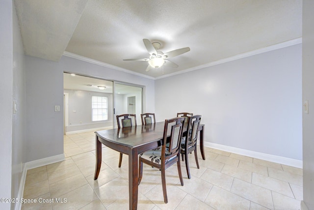 949 Brunswick Ln, Rockledge, FL 32955 - dining area with a ceiling fan, light tile patterned floors, crown molding, and a textured ceiling