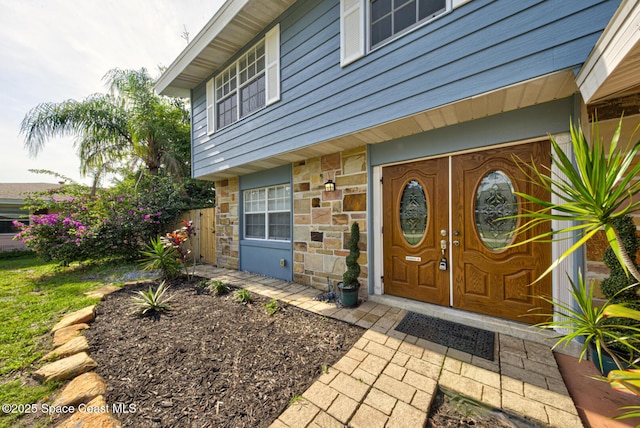949 Brunswick Ln, Rockledge, FL 32955 - property entrance with stone siding