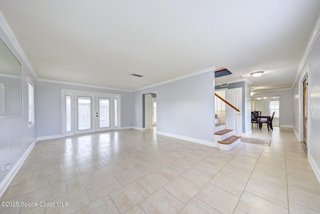 949 Brunswick Ln, Rockledge, FL 32955 - spare room with crown molding, stairs, healthy amount of natural light, and light tile patterned floors