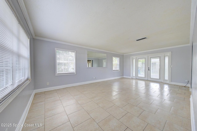 949 Brunswick Ln, Rockledge, FL 32955 - unfurnished room featuring crown molding, light tile patterned floors, and a textured ceiling