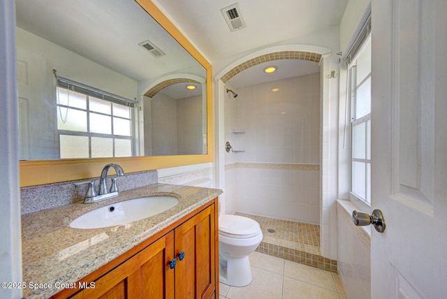 949 Brunswick Ln, Rockledge, FL 32955 - full bath featuring vanity, tiled shower, and tile patterned flooring