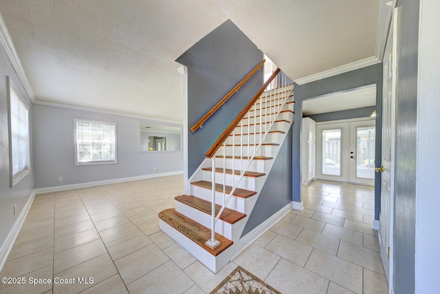 949 Brunswick Ln, Rockledge, FL 32955 - staircase featuring crown molding, french doors, tile patterned floors, and a textured ceiling
