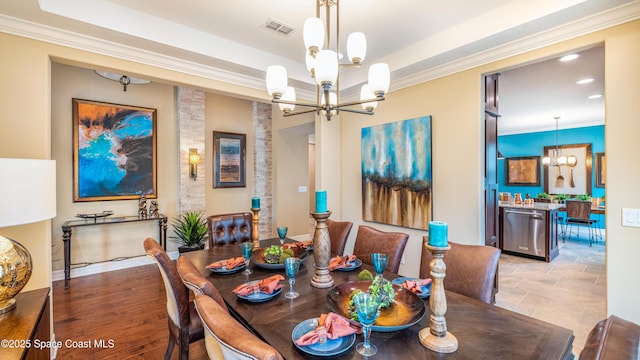 2683 Amati Dr, Kissimmee, FL 34741 - dining room featuring a chandelier, ornamental molding, a raised ceiling, and recessed lighting