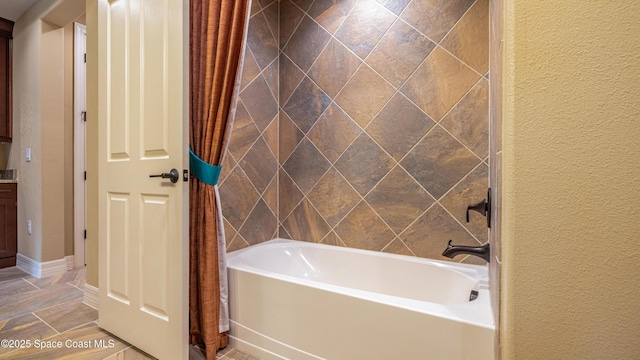 2683 Amati Dr, Kissimmee, FL 34741 - bathroom with shower / bathtub combination with curtain and a textured wall