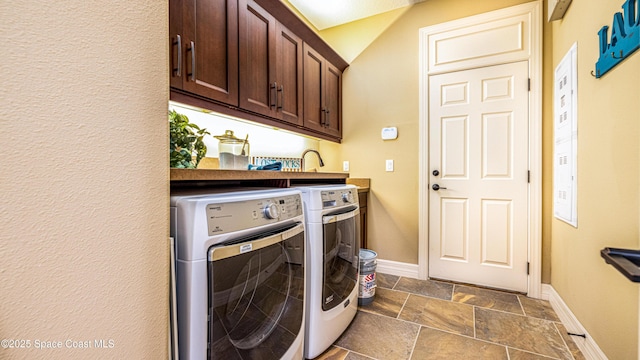2683 Amati Dr, Kissimmee, FL 34741 - laundry area featuring washer and clothes dryer, cabinet space, and stone tile flooring