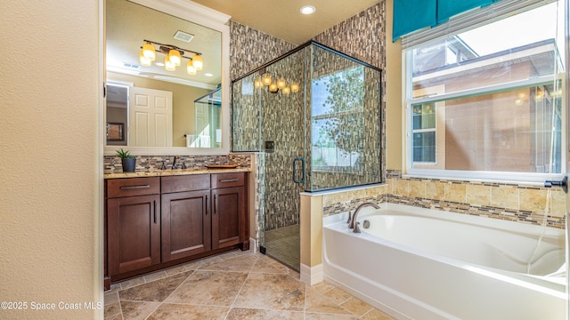 2683 Amati Dr, Kissimmee, FL 34741 - full bath with a garden tub, vanity, and a stall shower