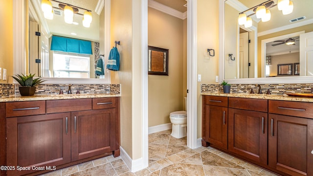 2683 Amati Dr, Kissimmee, FL 34741 - bathroom featuring crown molding, backsplash, vanity, and ceiling fan