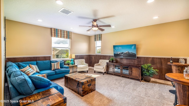 2683 Amati Dr, Kissimmee, FL 34741 - living room with a wainscoted wall, carpet, wooden walls, recessed lighting, and ceiling fan