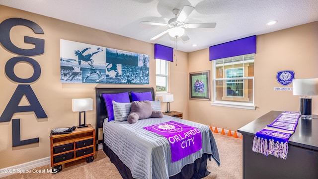 2683 Amati Dr, Kissimmee, FL 34741 - carpeted bedroom with ceiling fan, recessed lighting, and a textured ceiling
