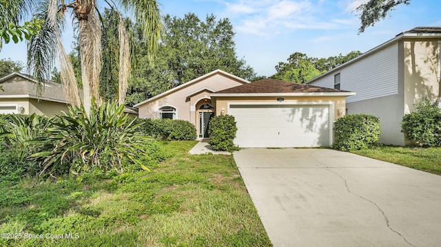 1119 Macon Dr, Titusville, FL 32780 - single story home with stucco siding, a garage, driveway, and a front lawn
