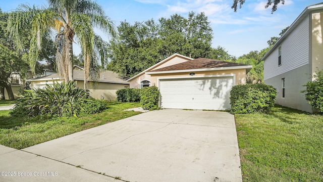 1119 Macon Dr, Titusville, FL 32780 - ranch-style house with a garage, driveway, a front lawn, and stucco siding
