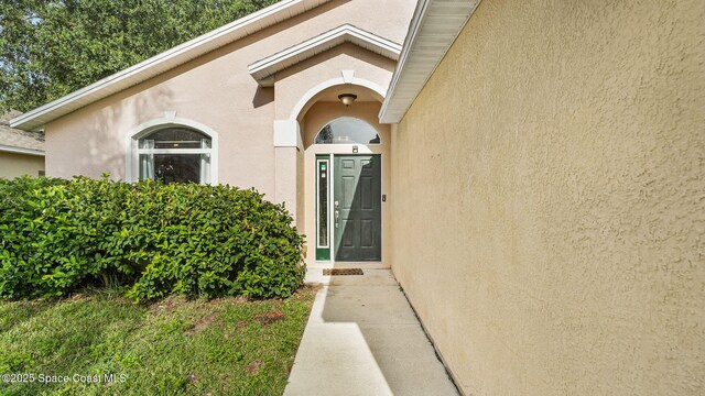 1119 Macon Dr, Titusville, FL 32780 - entrance to property featuring stucco siding