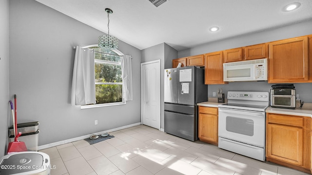 1119 Macon Dr, Titusville, FL 32780 - kitchen featuring white appliances, light countertops, recessed lighting, hanging light fixtures, and lofted ceiling