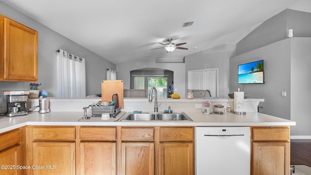 1119 Macon Dr, Titusville, FL 32780 - kitchen featuring white dishwasher, lofted ceiling, a ceiling fan, light countertops, and arched walkways