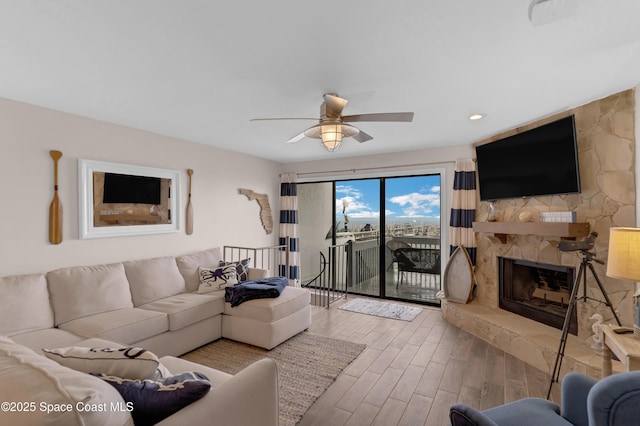 57 Broad St Unit 6, Titusville, FL 32796 - living room with wood finished floors, a fireplace, and ceiling fan