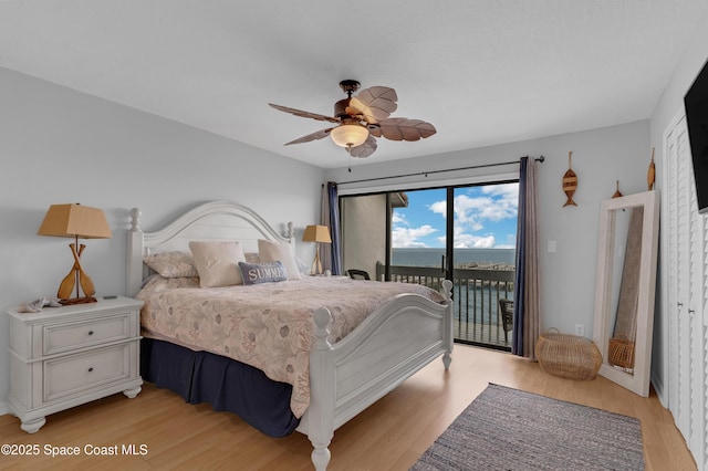 57 Broad St Unit 6, Titusville, FL 32796 - bedroom featuring access to outside, light wood finished floors, and a ceiling fan