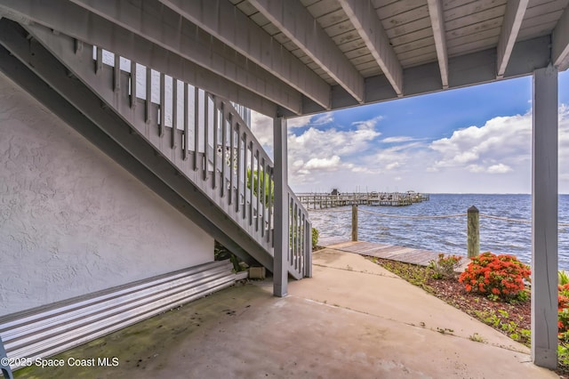 57 Broad St Unit 6, Titusville, FL 32796 - view of patio featuring stairway and a water view