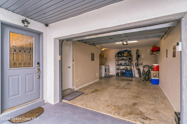 57 Broad St Unit 6, Titusville, FL 32796 - garage featuring independent washer and dryer and baseboards