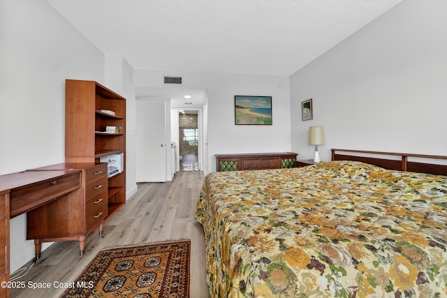 10777 W Sample Rd Unit 1212, Coral Springs, FL 33067 - bedroom with light wood-style flooring