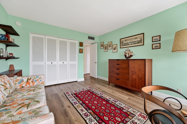 10777 W Sample Rd Unit 1212, Coral Springs, FL 33067 - living area with wood finished floors and baseboards