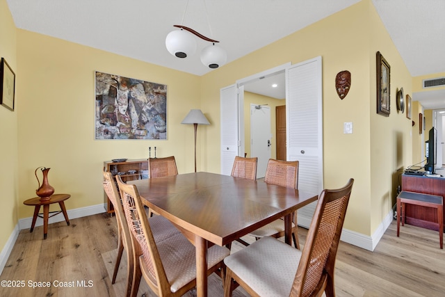 10777 W Sample Rd Unit 1212, Coral Springs, FL 33067 - dining space featuring light wood-style flooring