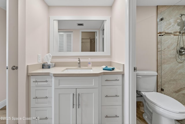 10777 W Sample Rd Unit 1212, Coral Springs, FL 33067 - bathroom with vanity, a stall shower, and a closet
