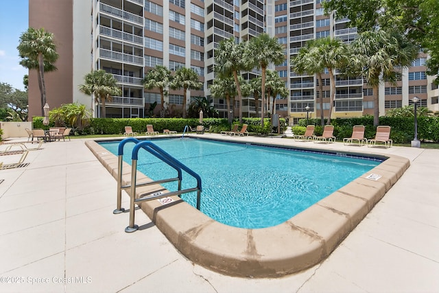 10777 W Sample Rd Unit 1212, Coral Springs, FL 33067 - community pool featuring a patio area
