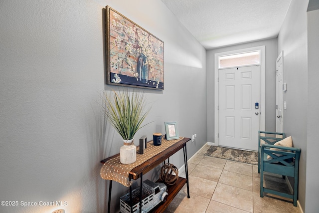 820 Old Country Rd SE, Palm Bay, FL 32909 - foyer with a textured ceiling and light tile patterned flooring