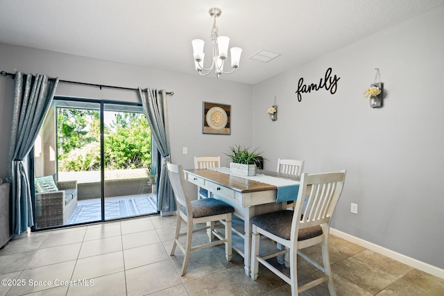 820 Old Country Rd SE, Palm Bay, FL 32909 - dining area with a chandelier and light tile patterned floors