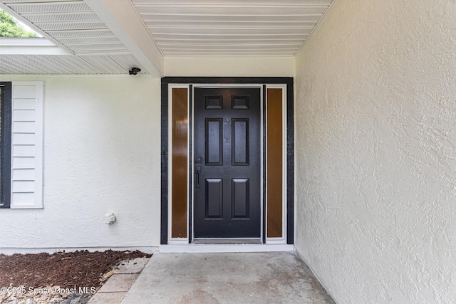 4890 Yew Ct, Titusville, FL 32796 - view of exterior entry with stucco siding