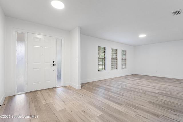 4890 Yew Ct, Titusville, FL 32796 - foyer featuring light wood-style floors and baseboards