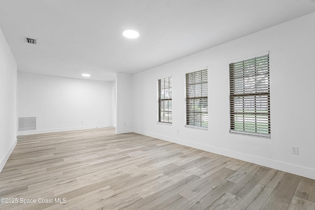 4890 Yew Ct, Titusville, FL 32796 - spare room featuring light wood-style flooring and recessed lighting