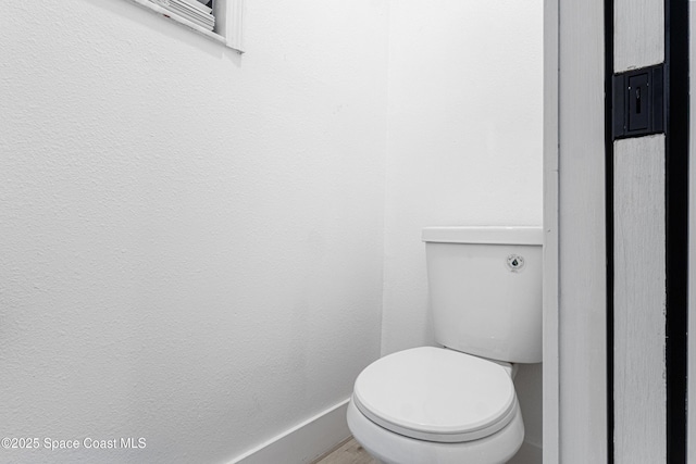 4890 Yew Ct, Titusville, FL 32796 - bathroom with toilet and wood finished floors